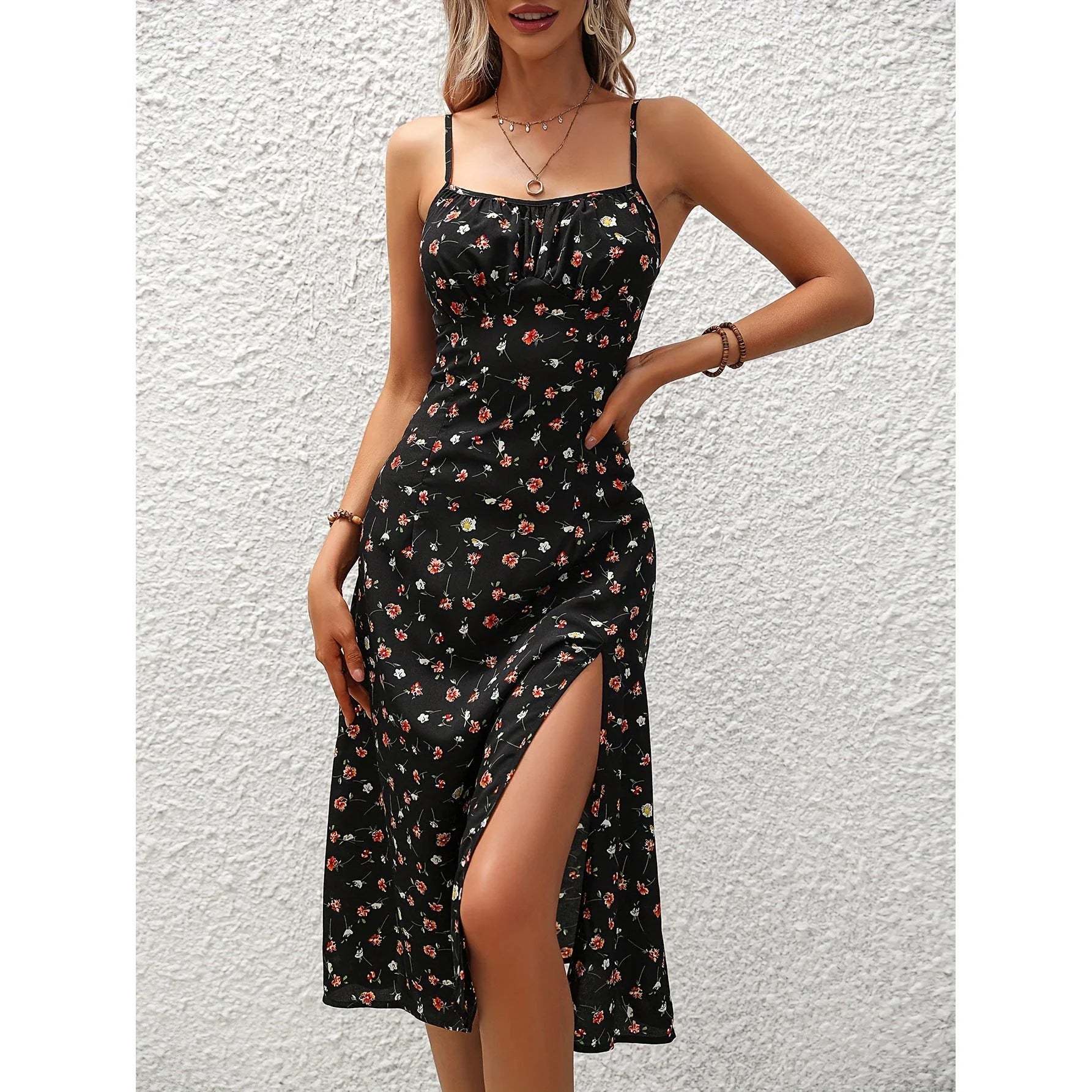 Stylish polka dot suspender dress with adjustable straps, side slit, and available in multiple vibrant colors