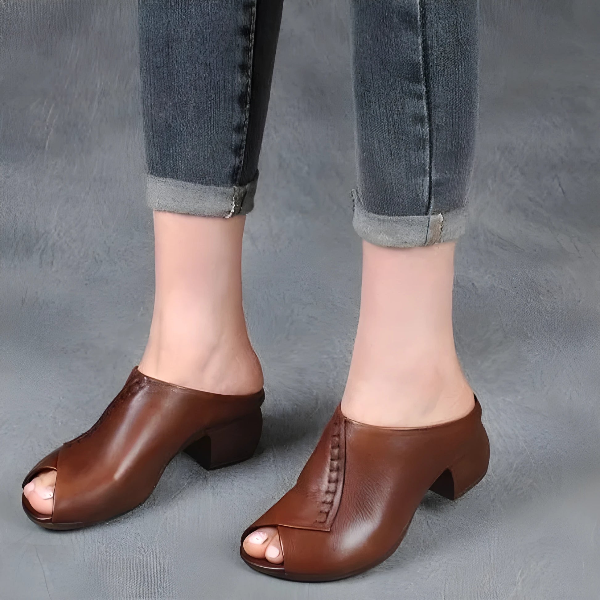 Women's black square heel peep toe slippers with a fish mouth scaffold design and rubber sole.
