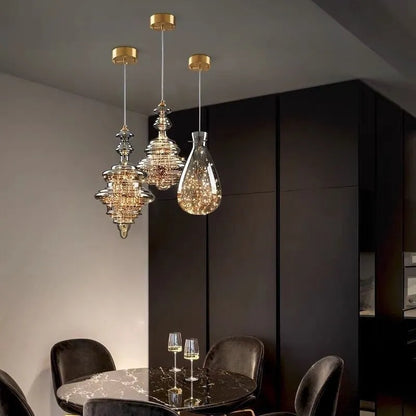 Modern adjustable glass droplight chandelier with LED lighting on a long suspension cable.