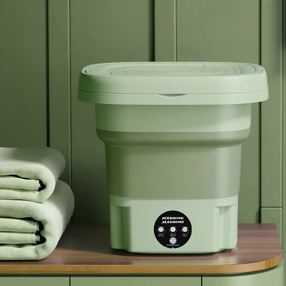 Green retractable folding washing machine showing 26cm dimensions and USB power connection