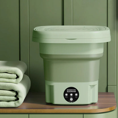 Green retractable folding washing machine showing 26cm dimensions and USB power connection