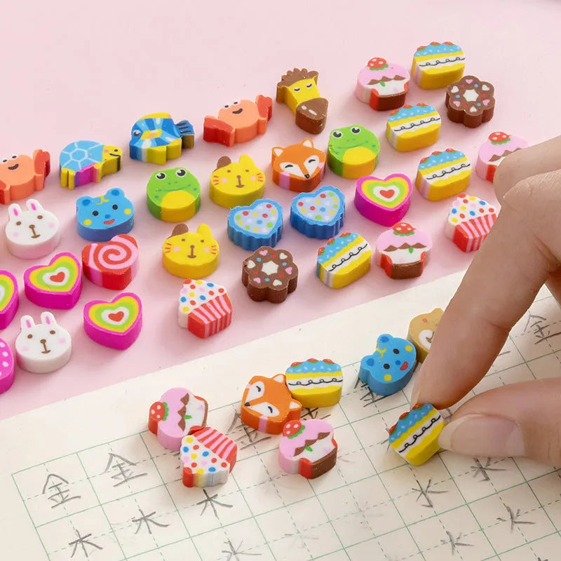 Assortment of 50 small cartoon erasers in pearlescent bags, showing fruit, animal, and holiday designs.