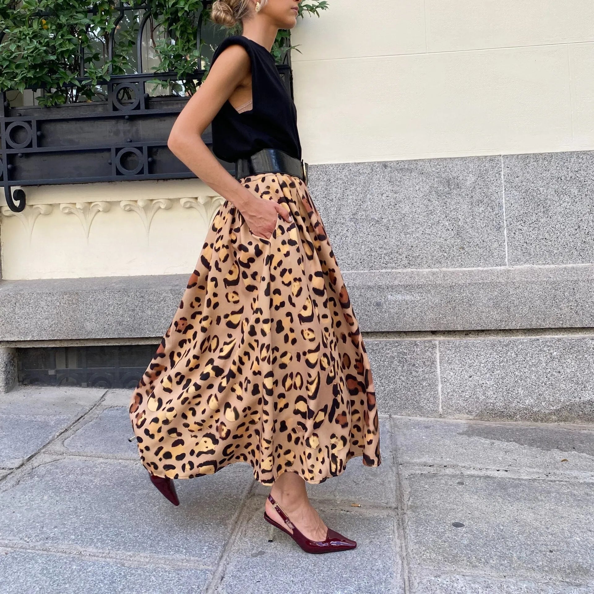 Brown leopard print A-line long skirt with 120cm hem, made from 100% polyester fabric, shown in sizes S to XL.