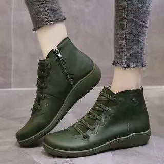 Women's casual booties with wedge heel and round toe in various colours like black and leopard print, showing rubber sole.