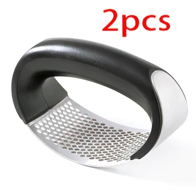 Stainless steel garlic press with uniform mincing holes measuring 10.5cm in length