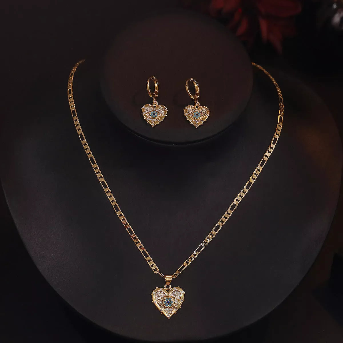 Heart-shaped zircon pendant and earrings set with copper plating and real gold accents