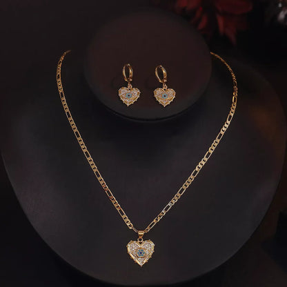 Heart-shaped zircon pendant and earrings set with copper plating and real gold accents
