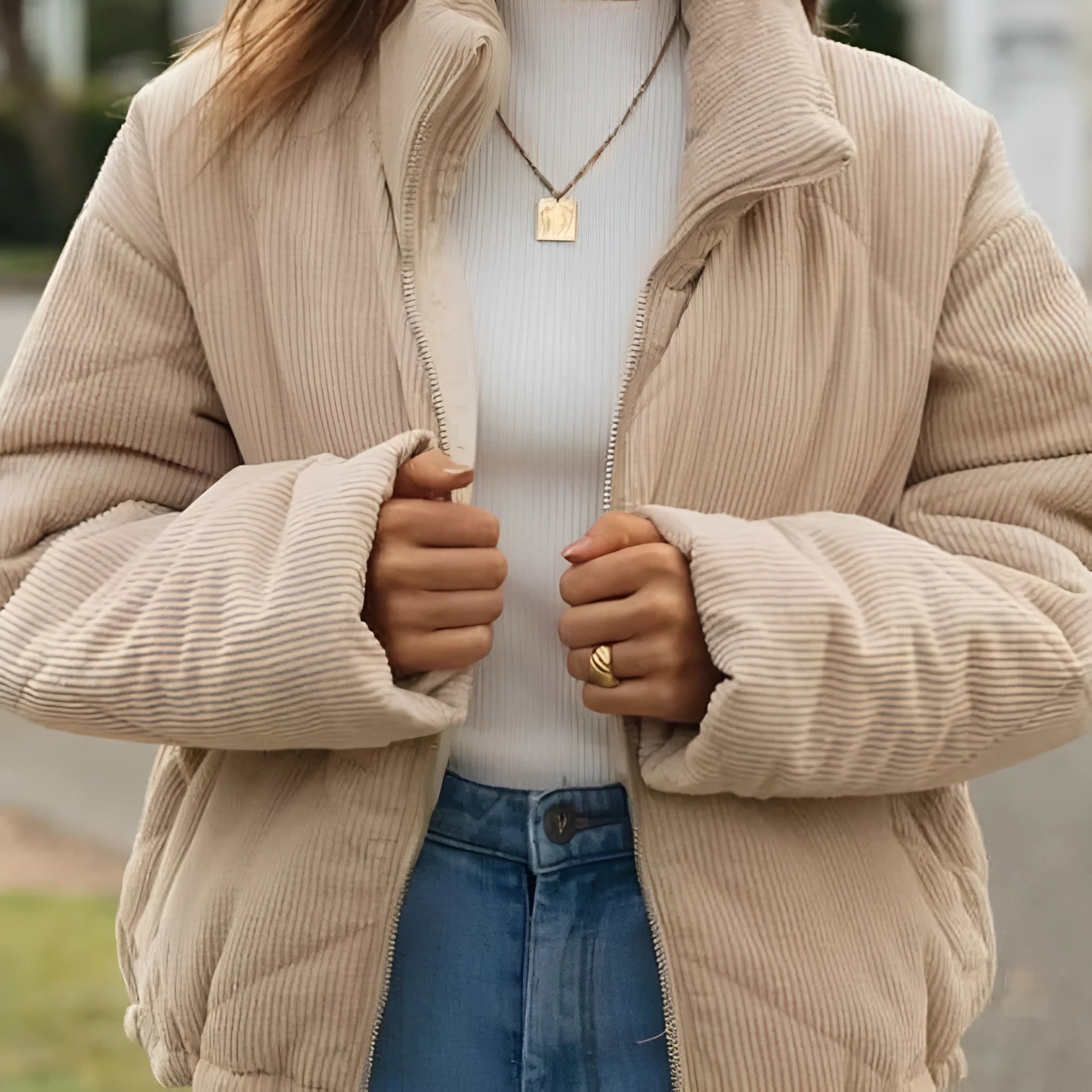 Apricot women's corduroy jacket with a stand collar and front zip, laid flat.