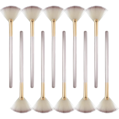 Ten soft fibre facial fan brushes with champagne finish acrylic handles and brush covers.
