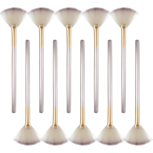 Ten soft fibre facial fan brushes with champagne finish acrylic handles and brush covers.