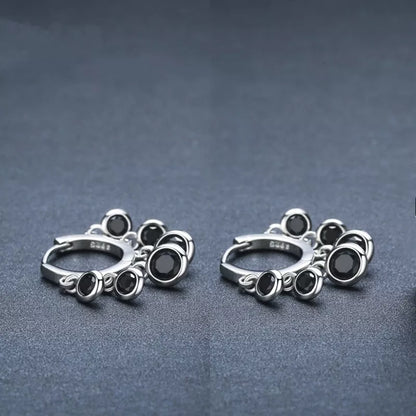 Copper inlaid round zircon earrings with black tassel design