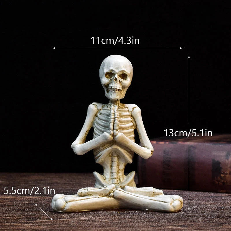 Spooky skeleton desktop decorations featuring intricate resin skulls and skeletons in vintage white and ominous black color options