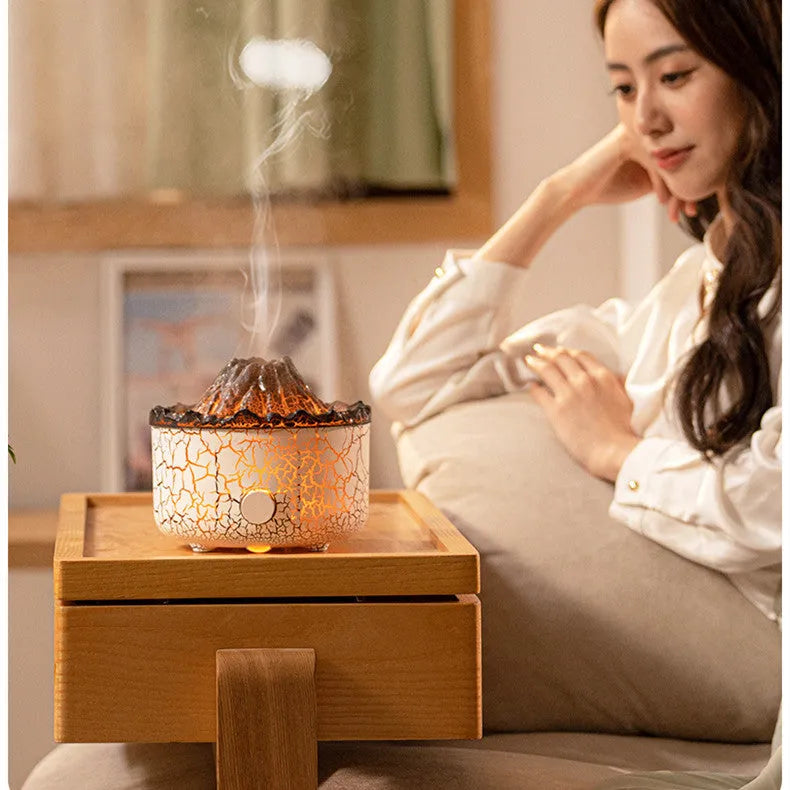 Volcanic humidifier with LED flame effect and mist spray on tabletop