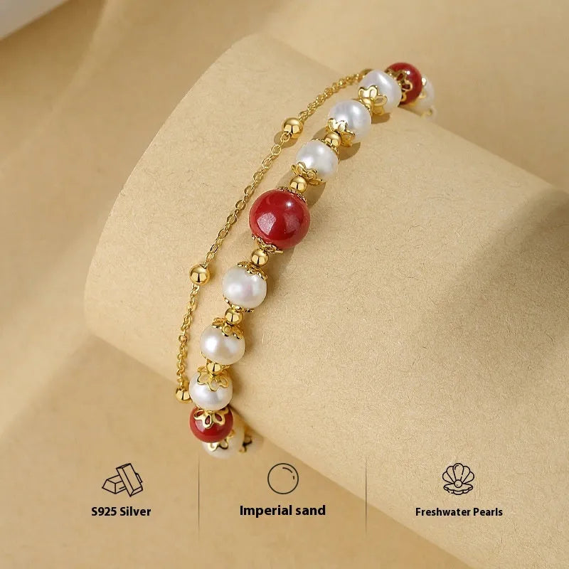Sterling silver double-layer bracelet with freshwater pearls and red cinnabar bean charms