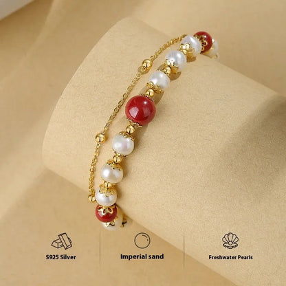 Sterling silver double-layer bracelet with freshwater pearls and red cinnabar bean charms