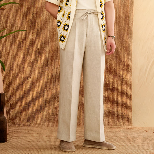 Linen high-waisted trousers with an elasticated waistband and loose straight-leg cut in greige colour