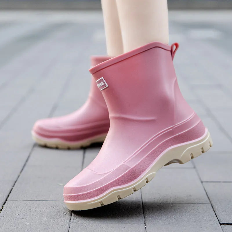 Women's low-cut white waterproof plastic shoes with a non-slip rubber sole on a plain background.