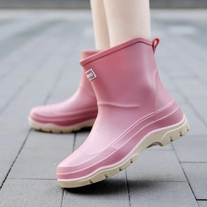 Women's low-cut white waterproof plastic shoes with a non-slip rubber sole on a plain background.