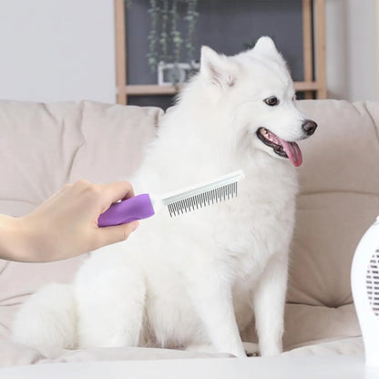 Purple detangling pet comb with stainless steel teeth for grooming dogs and cats, showing ergonomic handle.