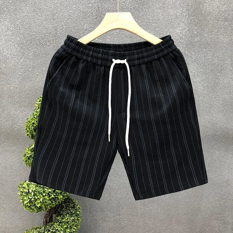 Men's black and white striped casual shorts with fleece lining, straight-leg cut, and ankle banding, shown in size M with waist 51cm