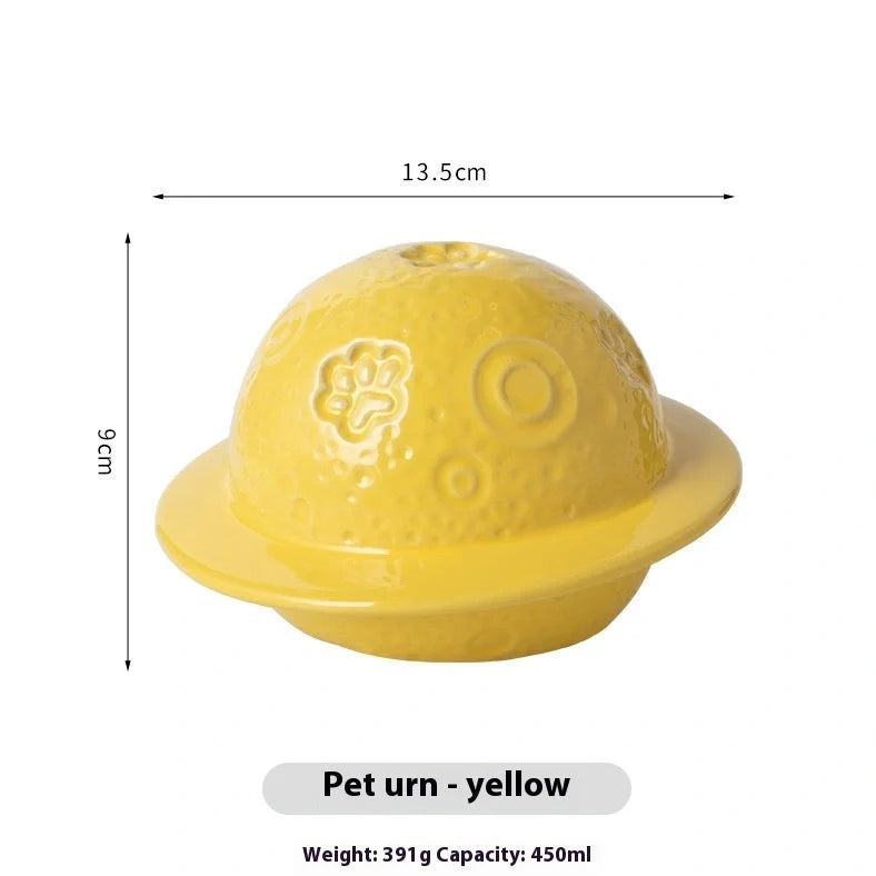 Handmade ceramic cinerary casket with cosmic starry sky design and cat-dog motifs in multiple colours