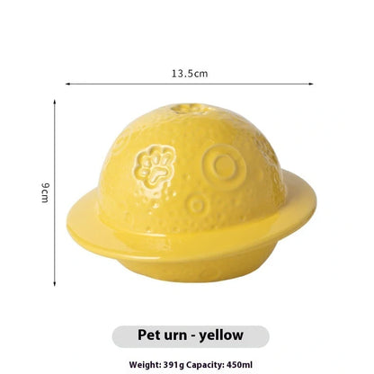 Handmade ceramic cinerary casket with cosmic starry sky design and cat-dog motifs in multiple colours