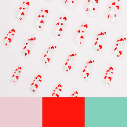 Sheet of 24 red diamond and cherry patterned nail art stickers with a small tube of adhesive glue.