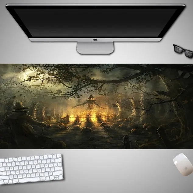 Oversized black mouse pad with Halloween-themed graphic, shown on a wooden desk with keyboard and gaming mouse.