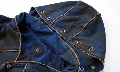 Blue hooded denim vest coat with front zip worn with matching trousers in a two-piece set.