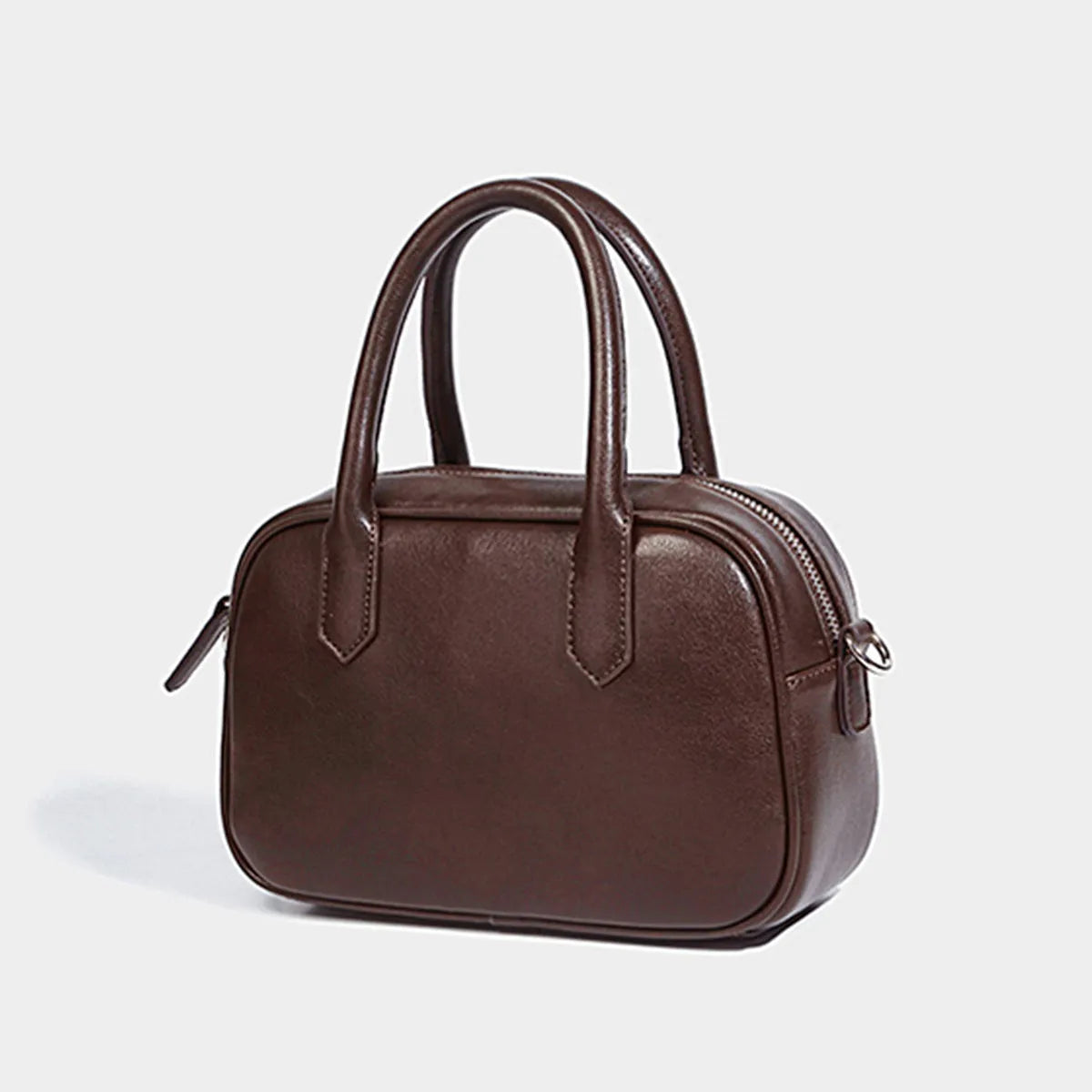 Retro square PU leather messenger bag with an adjustable shoulder strap in black colour.