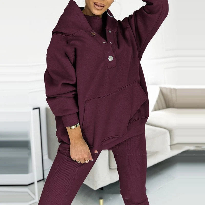 Women's 3-piece sports suit featuring a hooded sweatshirt with pockets and slim trousers