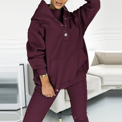 Women's 3-piece sports suit featuring a hooded sweatshirt with pockets and slim trousers