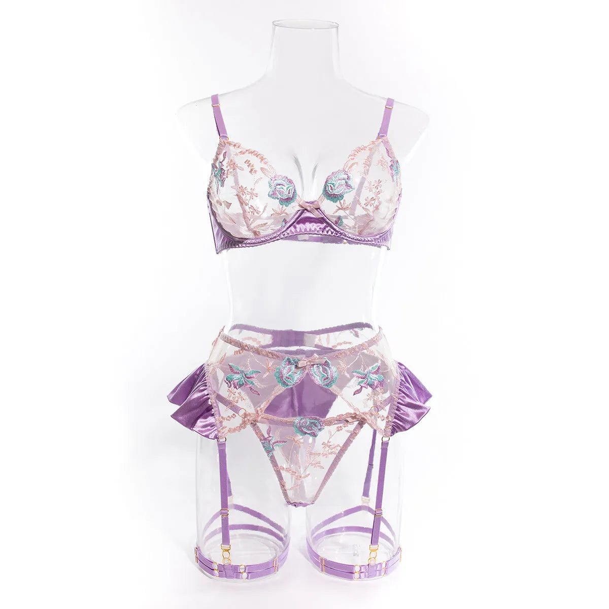 Light purple satin four-piece lingerie set with embroidery on a hanger