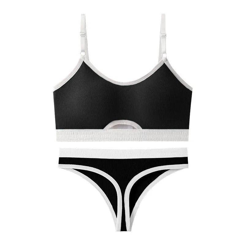White sports bra and briefs set with thin moulded cups and double shoulder straps on a grey background.