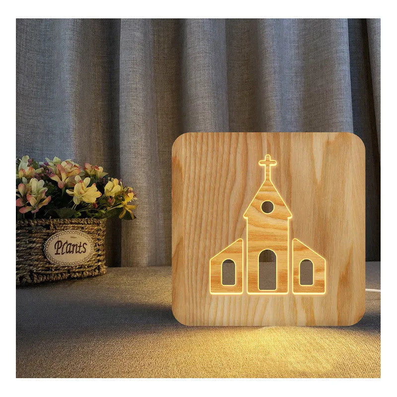 Solid wood hollow night lamp with warm white LED light on a surface