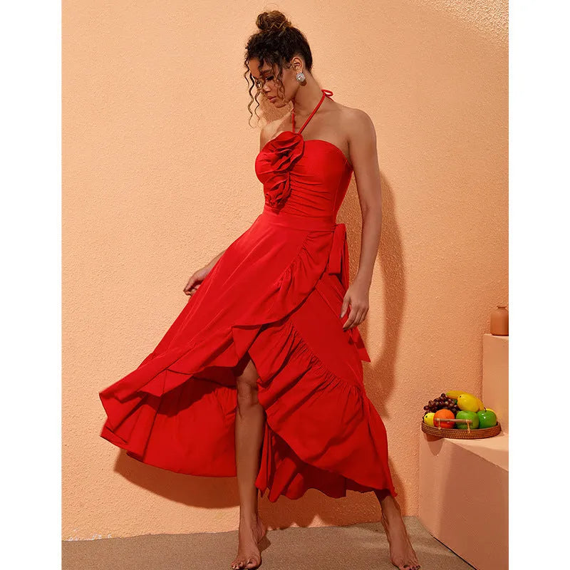 Red one-piece swimsuit with V-neck halter, open back, and a matching long skirt, with a detachable fabric flower.
