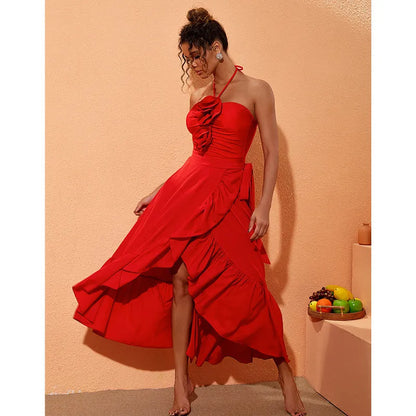 Red one-piece swimsuit with V-neck halter, open back, and a matching long skirt, with a detachable fabric flower.