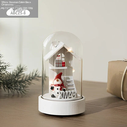 Small 15 cm glass reindeer night lamp in white snowman cabin style casting 100 lumen festive glow on table