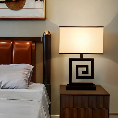 Retro style table lamp with fabric shade and iron base, remote control operation