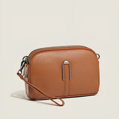 Minimalist top-grain leather crossbody bag in horizontal square shape with inner pockets, available in five colours