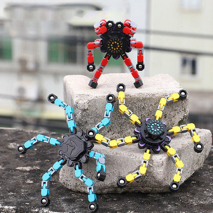 Transformable fidget spinner chain toy in various colors, including blue, red, and yellow, with a suction cup for hands-free spinning