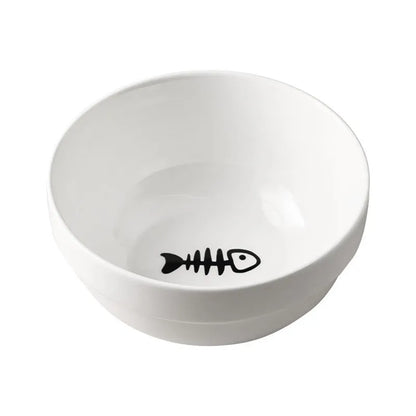 White ceramic pet bowl with cat paw design on a black iron frame raised feeder.