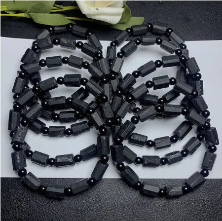 Natural black tourmaline rough stone bracelet with stretch cord on wrist