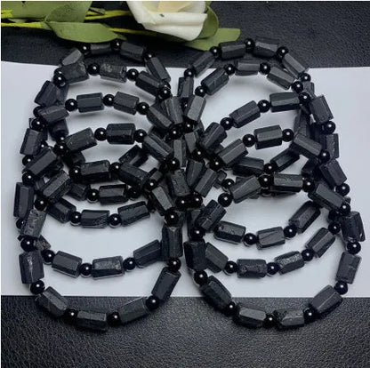 Natural black tourmaline rough stone bracelet with stretch cord on wrist