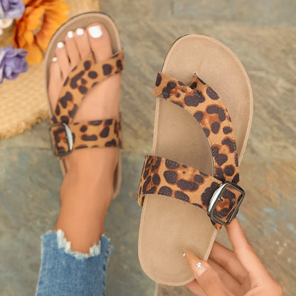 Leopard print Roman style slippers with a round toe and wooden sole.