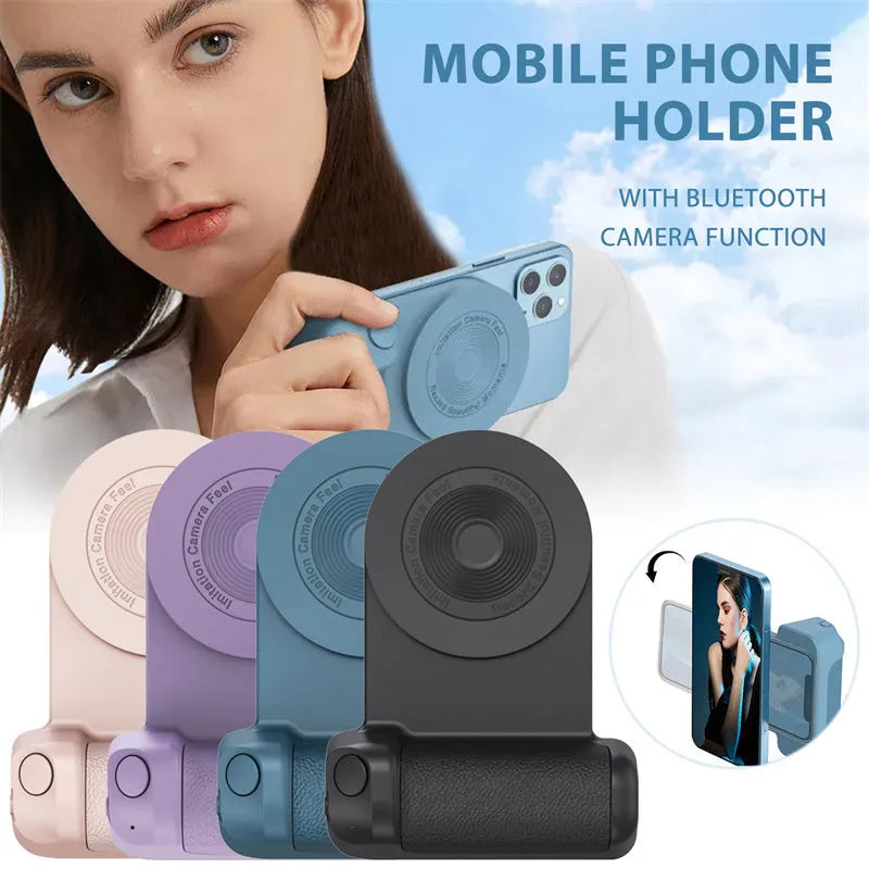 Black magnetic phone camera grip holder with rotatable stand on a table next to a smartphone.