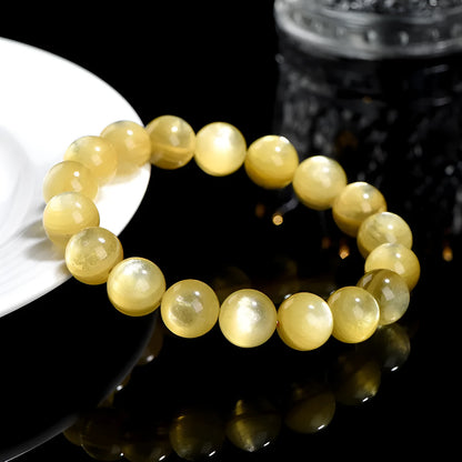 Yellow golden dragon mica round beads bracelet with polished lepidolite gemstones.