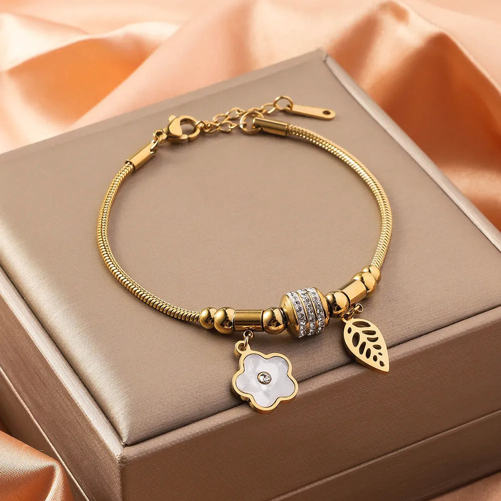 Titanium steel inlaid shell bracelet with electroplated finish showing pattern variation options
