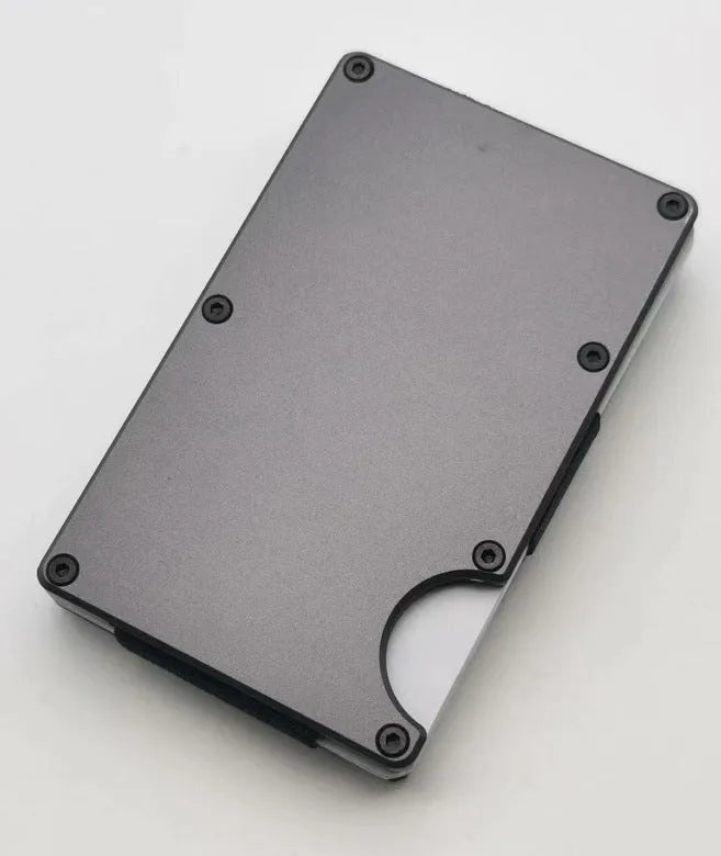 Carbon fibre wallet for credit cards, durable RFID-blocking anti-theft wallet constructed from a lightweight aluminium alloy grey carbon fibre material with a slim design for secure card storage and everyday carry.
