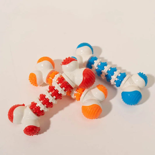 Bone-shaped interactive dog toy in blue, orange, or red for small breeds with treat holder